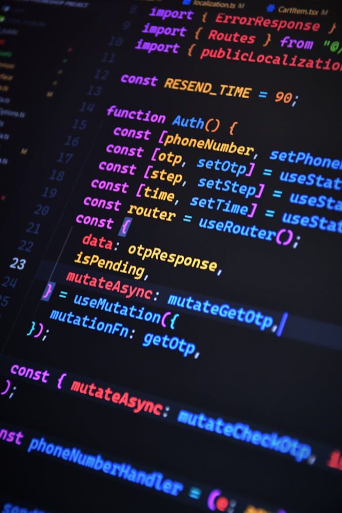 Close-up of vibrant JavaScript code for web development with ReactJS and Tailwind CSS.